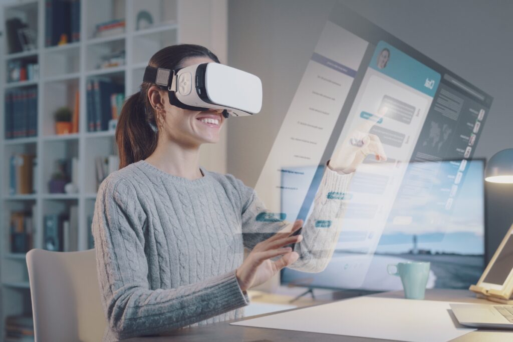woman using VR headset at computer