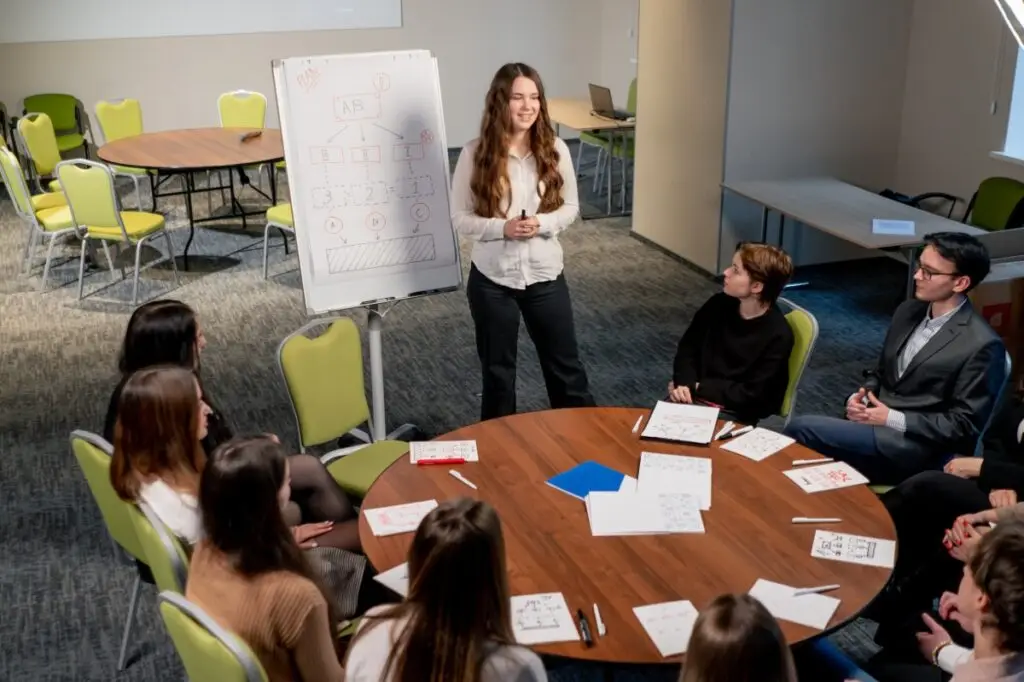 woman leads small educational conference