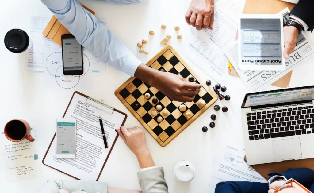 concept of business strategy meeting with chess board