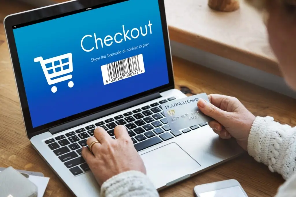 checkout webpage with customer holding credit card