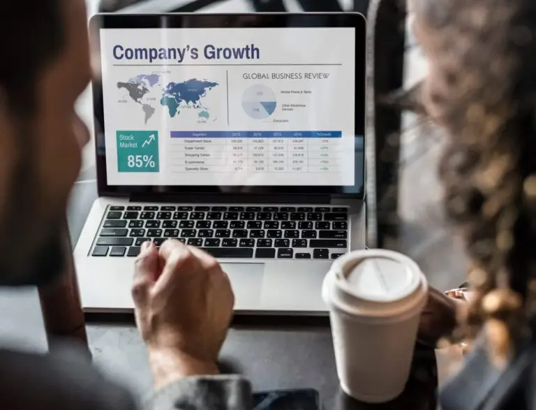 Laptop displaying webpage that says "Company's Growth"