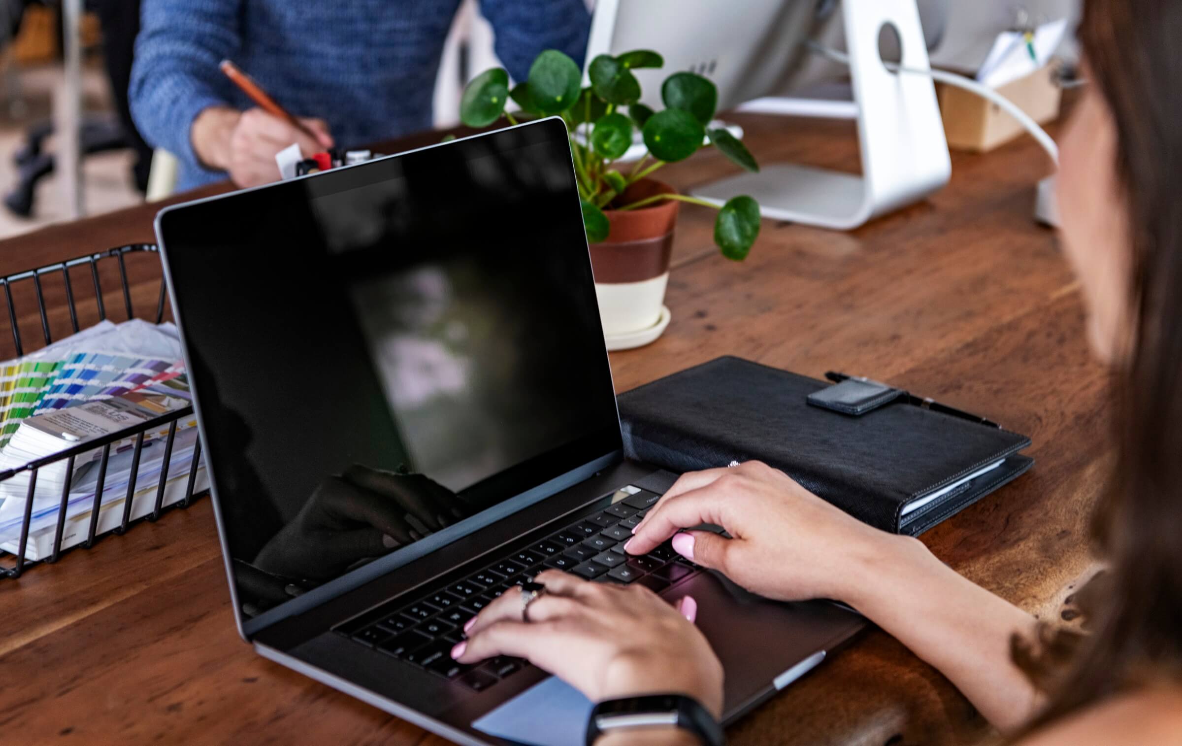person typing on laptop