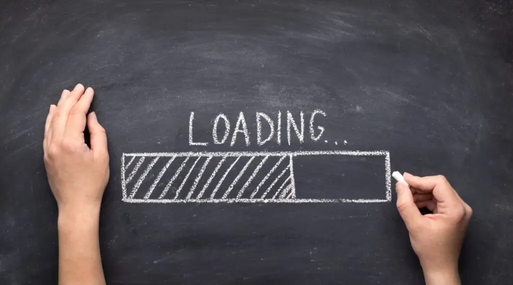 hand writing a loading process bar on a chalkboard
