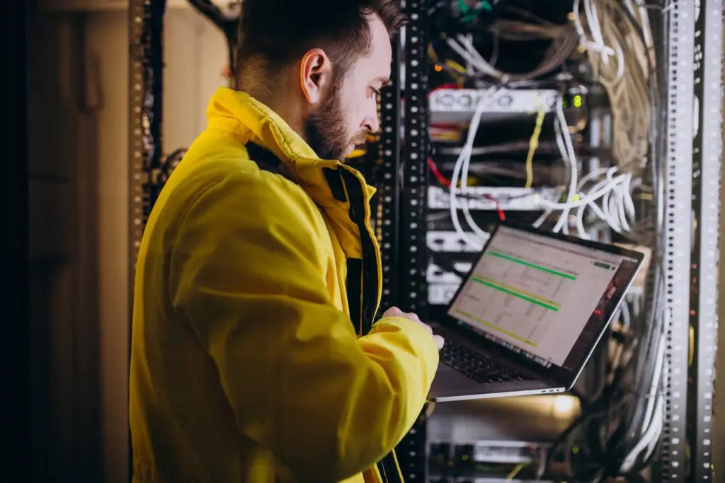 young man next to a server