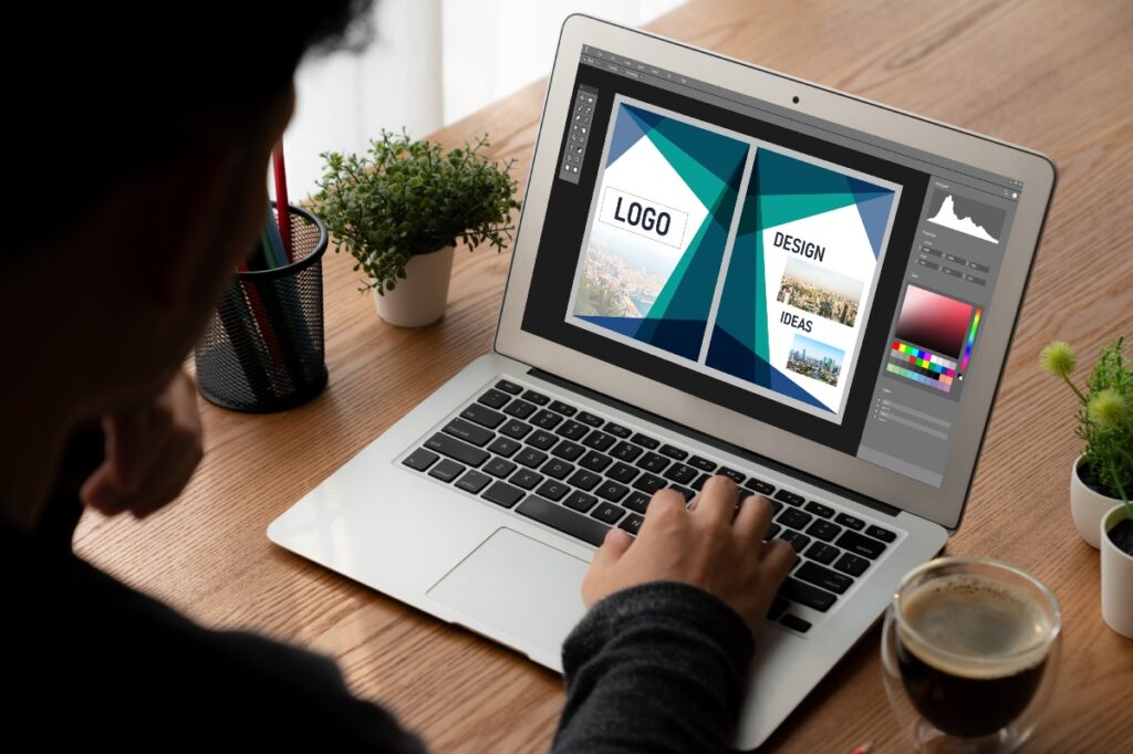 computer screen displaying logo and web design concept