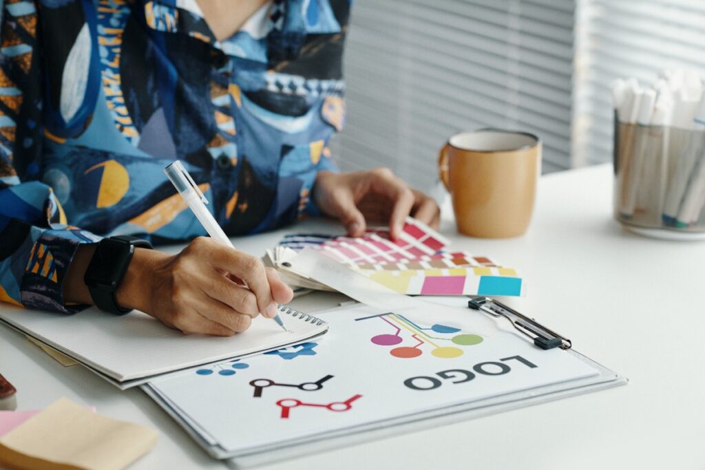 female designer choosing colors for logo design