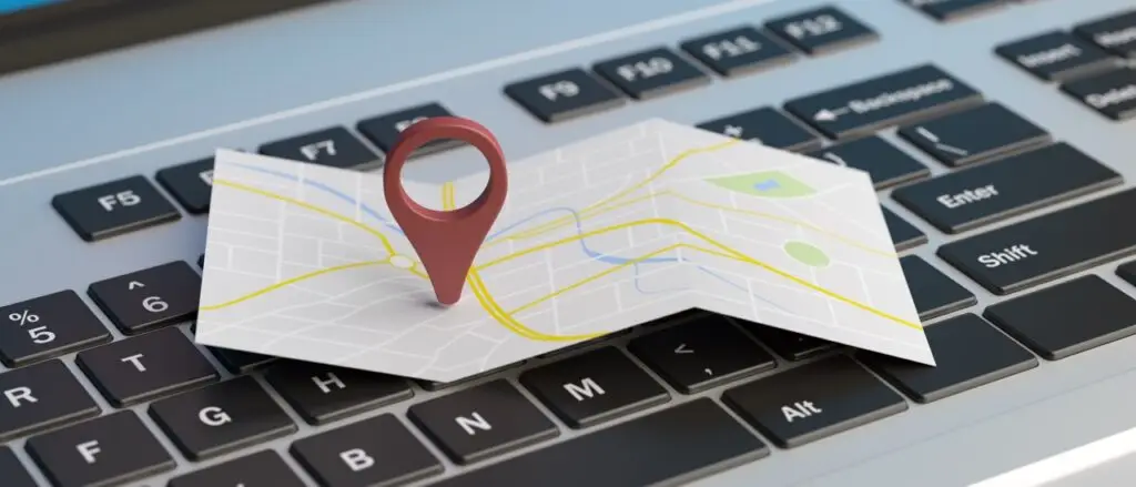 Google Maps Rankings Location Pin and map placed over computer keyboard