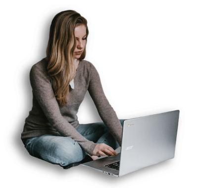 An image of a girl working on a laptop